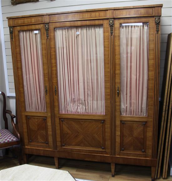 A Louis XVI style satinwood three door display cabinet, H.192cm